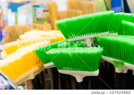 Large assortment of brushes for cleaning premises in the store. Trade in floor cleaning equipment Large assortment of brushes for cleaning premises in the store. Trade in floor cleaning equipment 107929960
