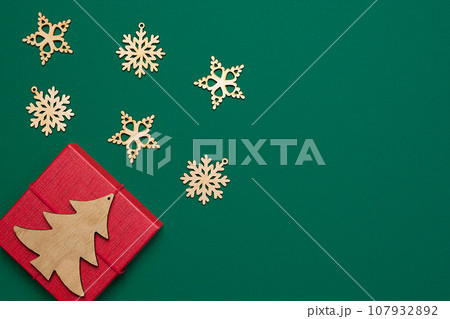 Christmas banner with blank space for text, fir tree branches, red ornaments. New Year Green Background. Decoration. Greeting Card Mockup. Confetti, Gift Box. Dark Green Noel Festive Backdrop Template Christmas banner with blank space for text, fir tree branches, red ornaments. New Year Green Background. Decoration. Greeting Card Mockup. Confetti, Gift Box. Dark Green Noel Festive Backdrop Template 107932892