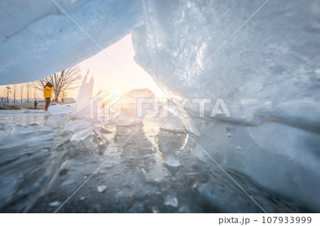 Frozen lake in South Korea in winter in sunrise at Dumulmeori, Yangpyeong, South Korea. Frozen lake in South Korea in winter in sunrise at Dumulmeori, Yangpyeong, South Korea. 107933999