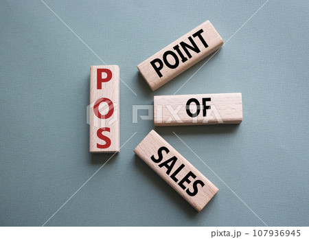 POS - Point Of Sales symbol. Wooden cubes with words POS. Beautiful grey green background. Business and POS concept. Copy space. POS - Point Of Sales symbol. Wooden cubes with words POS. Beautiful grey green background. Business and POS concept. Copy space. 107936945