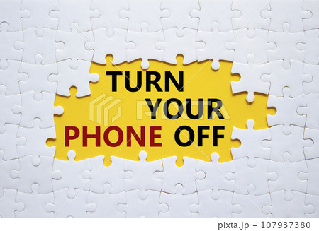 Turn Your Phone off symbol. White puzzle with words Turn Your Phone off. Beautiful yellow background. Business concept. Copy space. 107937380