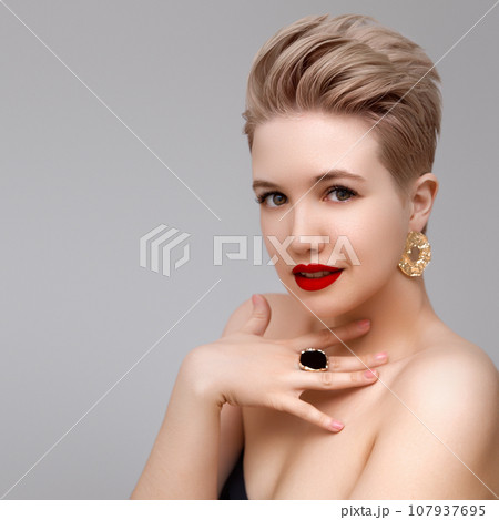 Beautiful girl with set jewelry . Woman with a Beautiful girl with set jewelry . Woman with a 107937695