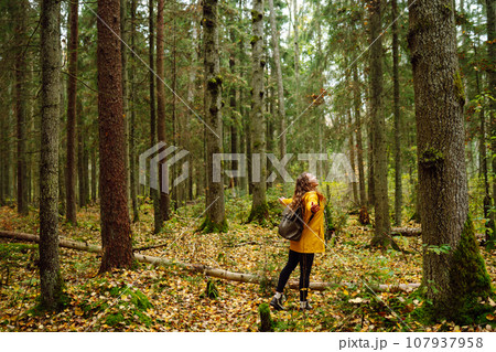 Young woman explores new, fantastic places around world, surrounded by nature relax Active Lifestyle 107937958