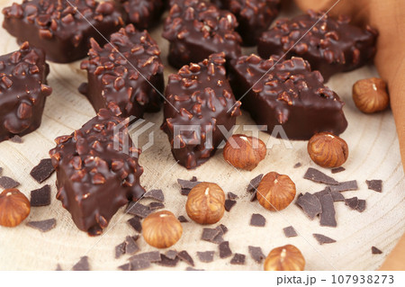 Chocolate with hazelnuts Chocolate with hazelnuts 107938273