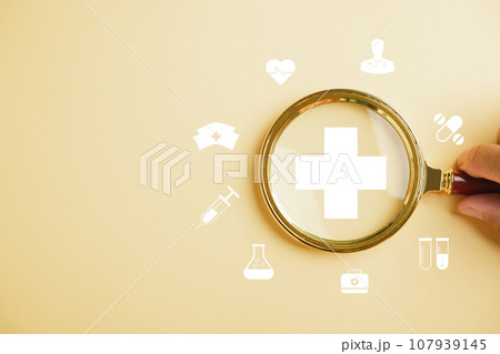 Health insurance in focus, Magnifying glass highlights plus symbol and healthcare icon. Showcases welfare health access, innovation, and quality care. health concept 107939145