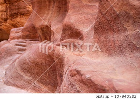 Kayon Sik. A close-up view of the winding road and undulating canyon walls. Petra Jordan 107940582