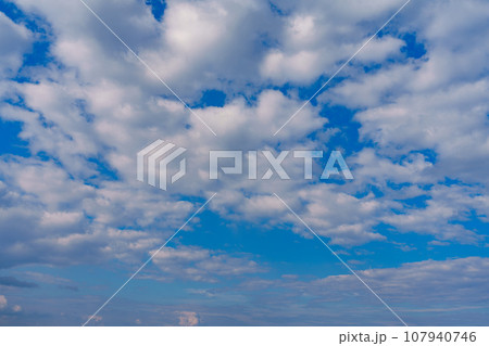 Blue Sky with Lots of White Clouds: Background for Replacement or Inspiring Ideas 107940746