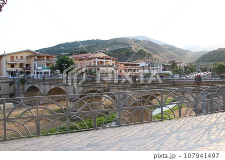 view of the town of Diamante, Cosenza, Calabria, Italy with famous bridge over the river that flows into the sea 107941497