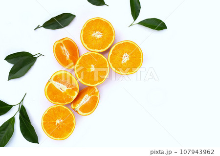 Orange fruit with green leaves on white background. Orange fruit with green leaves on white background. 107943962