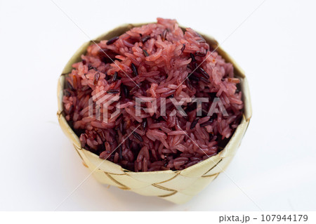 Black sticky rice on white background. 107944179