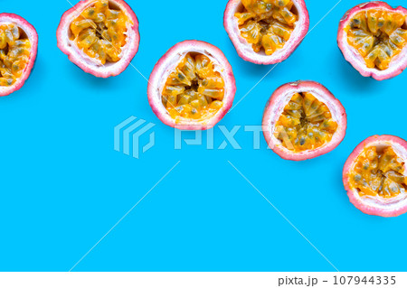 Passion fruit on blue background. Passion fruit on blue background. 107944335