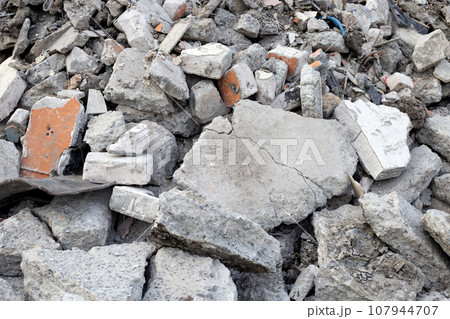 Piles of rubble after house demolition 107944707