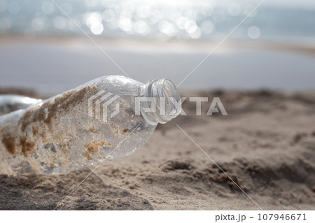 Plastic bottle on the beach Plastic bottle on the beach 107946671