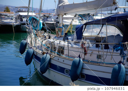 Luxury yachts and motor boats in marina at sunset 107946831