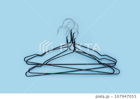 Clothes hangers on white background. Clothes hangers on white background. 107947055
