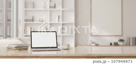 A white-screen laptop mockup on a luxury white marble table in a modern white room. workspace 107949971