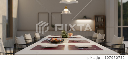Close-up image of a dining table with a beautiful and luxurious dining table setting Close-up image of a dining table with a beautiful and luxurious dining table setting 107950732