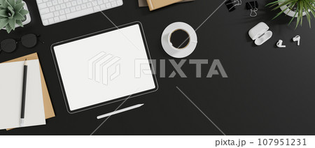 Top view of a stylish black office desk with digital tablet mockup and decor. Top view of a stylish black office desk with digital tablet mockup and decor. 107951231