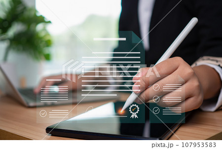 Businesswoman use electronic pen sign signature on electronic E-signing, data sheet document management, Electronic signature and paperless office concept. 107953583