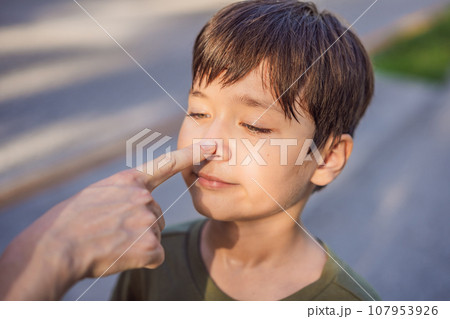 Nother touching her son's nose. Family relationship concept Nother touching her son's nose. Family relationship concept 107953926