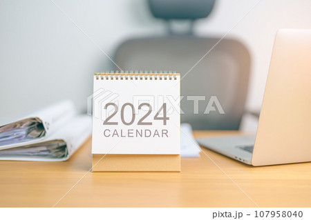 2024 Year Calendar on table background. countdown, Happy New Year, Resolution, Goals, Plan, Action, Mission and financial Concept 2024 Year Calendar on table background. countdown, Happy New Year, Resolution, Goals, Plan, Action, Mission and financial Concept 107958040