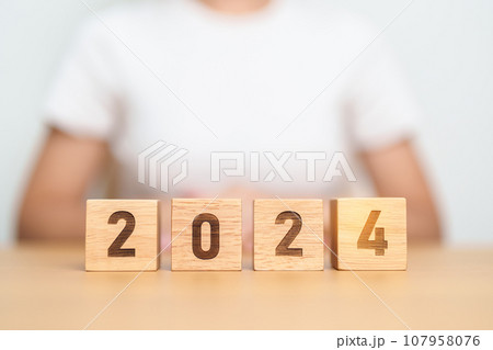 2024 year block on table. goal, Resolution, strategy, plan, start, budget, mission, action, motivation and New Year concepts 107958076