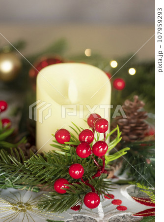 Christmas decorations and candle 107959293