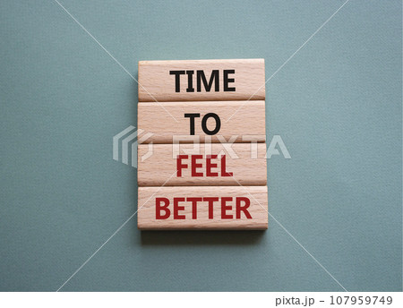 Time to feel better symbol. Wooden blocks with words Time to feel better. Beautiful grey green background. Medicine and Time to feel better concept. Copy space. 107959749