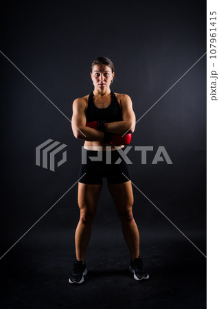 Young woman athletic female MMA fighter training. Concept of sport, action, healthy lifestyle. 107961415
