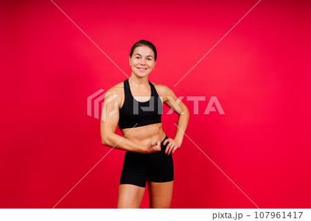 Young woman athletic female MMA fighter training. Concept of sport, action, healthy lifestyle. Young woman athletic female MMA fighter training. Concept of sport, action, healthy lifestyle. 107961417