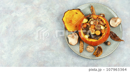 Tasty baked pumpkin with beef, mushrooms. Tasty baked pumpkin with beef, mushrooms. 107963364