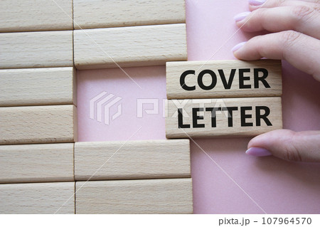 Cover Letter symbol. Concept word Cover Letter on wooden blocks. Businessman hand. Beautiful pink background. Business and Cover Letter concept. Copy space Cover Letter symbol. Concept word Cover Letter on wooden blocks. Businessman hand. Beautiful pink background. Business and Cover Letter concept. Copy space 107964570