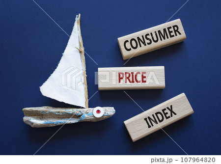 Consumer Price Index symbol. Concept words Consumer Price Index on wooden blocks. Beautiful deep blue background with boat. Business and Consumer Price Index concept. Copy space. 107964820