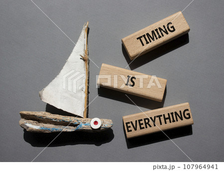Timing is Everything symbol. Wooden blocks with words Timing is Everything. Beautiful grey background with boat. Business and Timing is Everything concept. Copy space. 107964941