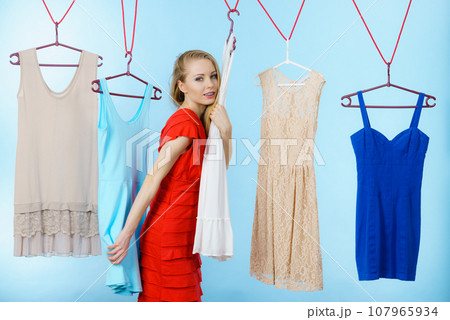 Woman choosing clothes in shop 107965934