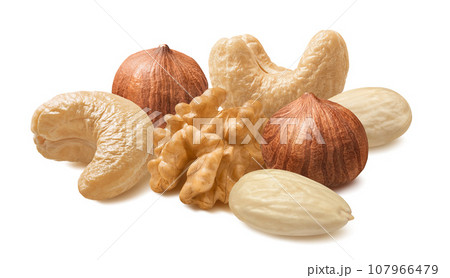 Walnut, cashew, blanched almond and hazelnut isolated on white background. Nut mix 107966479