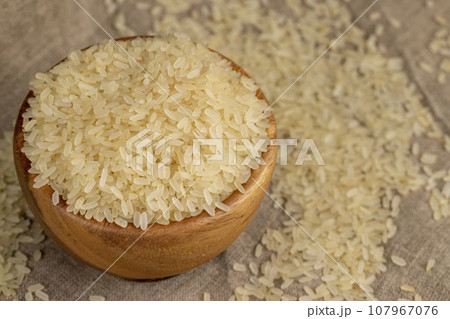 a large amount of uncooked fresh polished rice 107967076