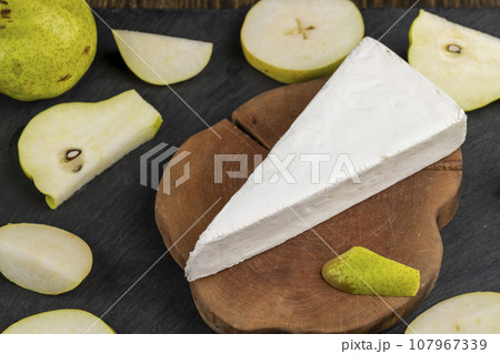 cheese with white mold cut into chunks 107967339