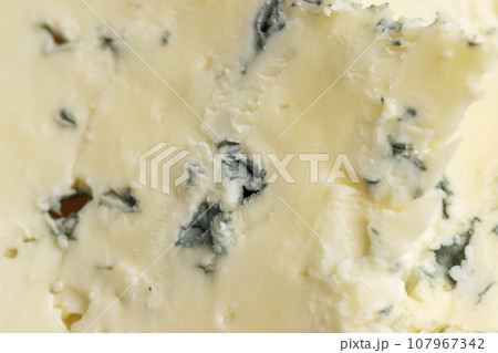 Cheese with blue mold cut into pieces Cheese with blue mold cut into pieces 107967342