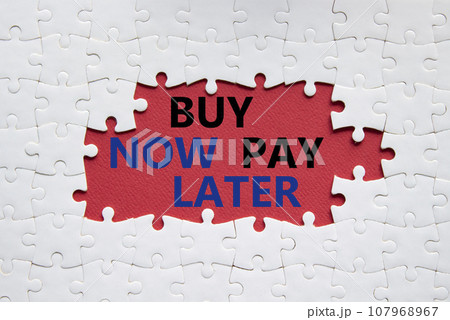 Buy now Pay later symbol. Concept word Buy now Pay later on white puzzle. Beautiful red background. Business and Buy now Pay later concept. Copy space Buy now Pay later symbol. Concept word Buy now Pay later on white puzzle. Beautiful red background. Business and Buy now Pay later concept. Copy space 107968967