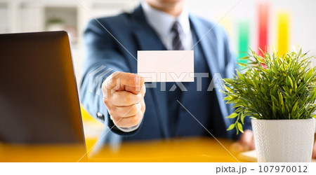 Male arm in suit give blank calling card Male arm in suit give blank calling card 107970012