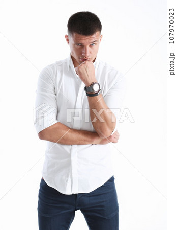 Young successful businessman on a white Young successful businessman on a white 107970023