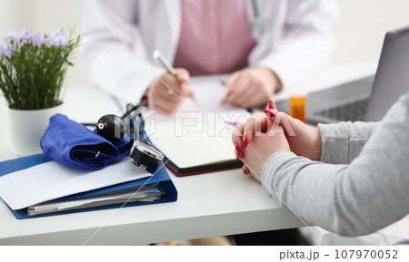 Female doctor hand hold silver pen 107970052