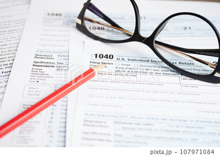 Tax form 1040 U.S. Individual Income Tax Return, business finance concept. Tax form 1040 U.S. Individual Income Tax Return, business finance concept. 107971084