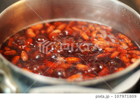 Boiled beans in boiling water close-up. Cooking homemade veggie food Boiled beans in boiling water close-up. Cooking homemade veggie food 107971809