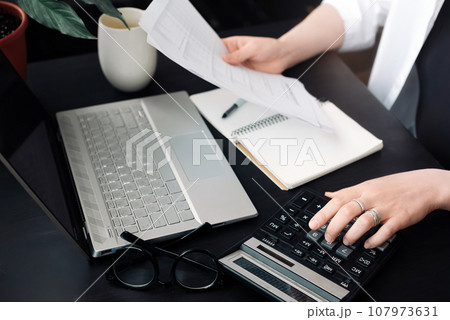 Successful Financial Planning: Businesswoman in Accounting. Close-Up of Accountant at Work. Document 107973631