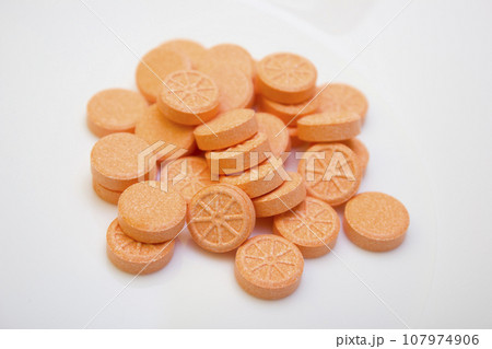 Many tablets and orange vitamin - protection during quarantine, coronavirus, covid19 107974906