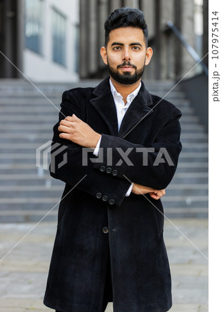 Happy business man smiling looking away dreaming resting, good news feel satisfied in city street Happy business man smiling looking away dreaming resting, good news feel satisfied in city street 107975414