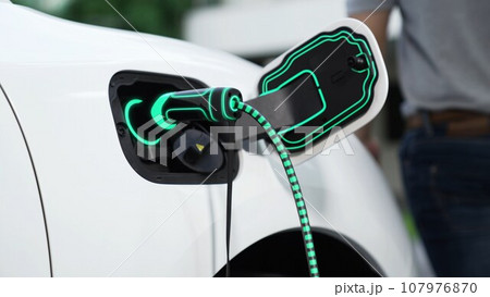 EV charger from home charging station plugged in EV car. Peruse EV charger from home charging station plugged in EV car. Peruse 107976870