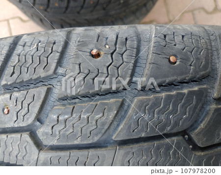 Old worn car tires. Damaged rubber. Old tyres Old worn car tires. Damaged rubber. Old tyres 107978200